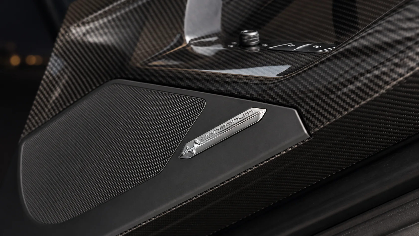 Aventador SV Roadster, roof off, at night by the water