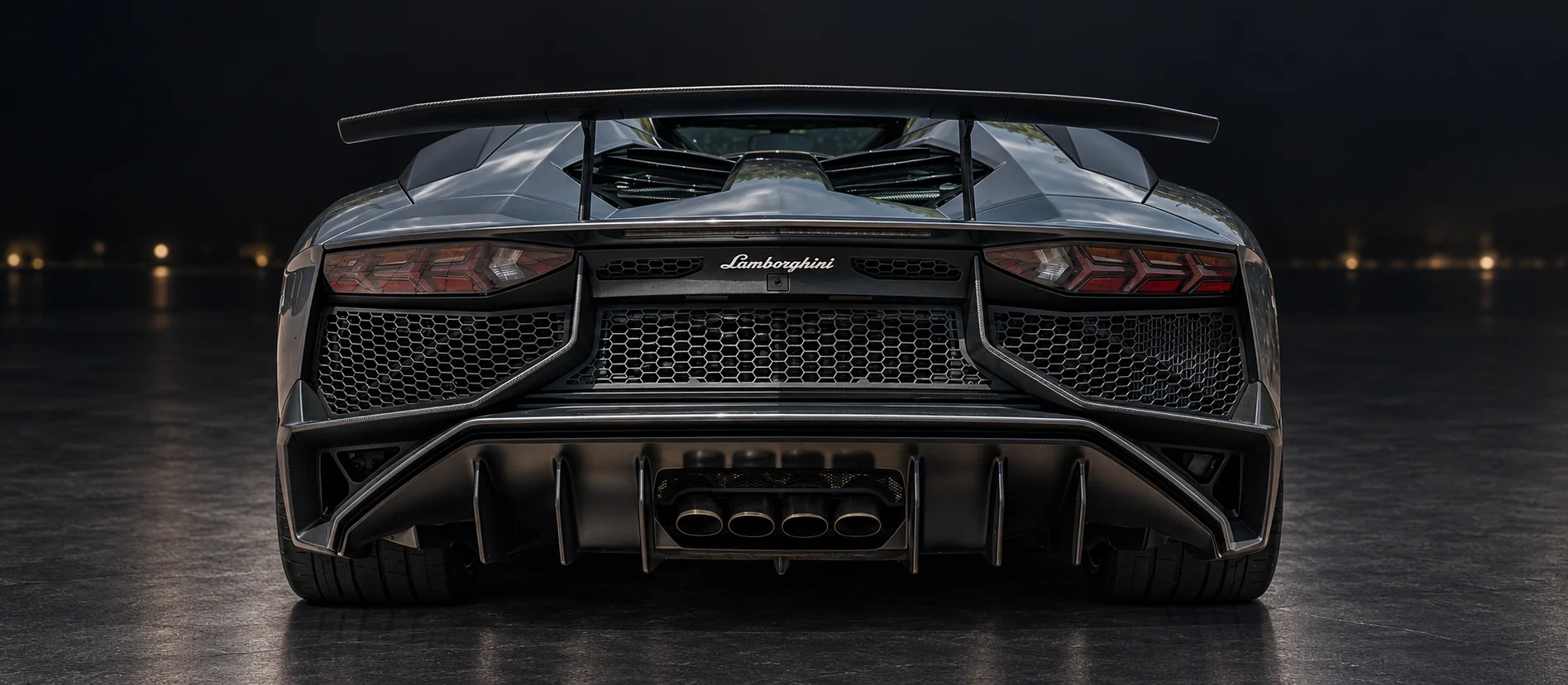 Rear of the SV Roadster at night — quad exhausts, diffuser and fixed rear wing